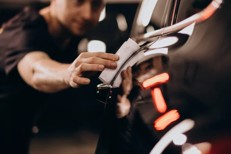 Onyx Coaing Certified installer applying Quartz Plus to a black car - ONYX COATING unveils Quartz Plus
